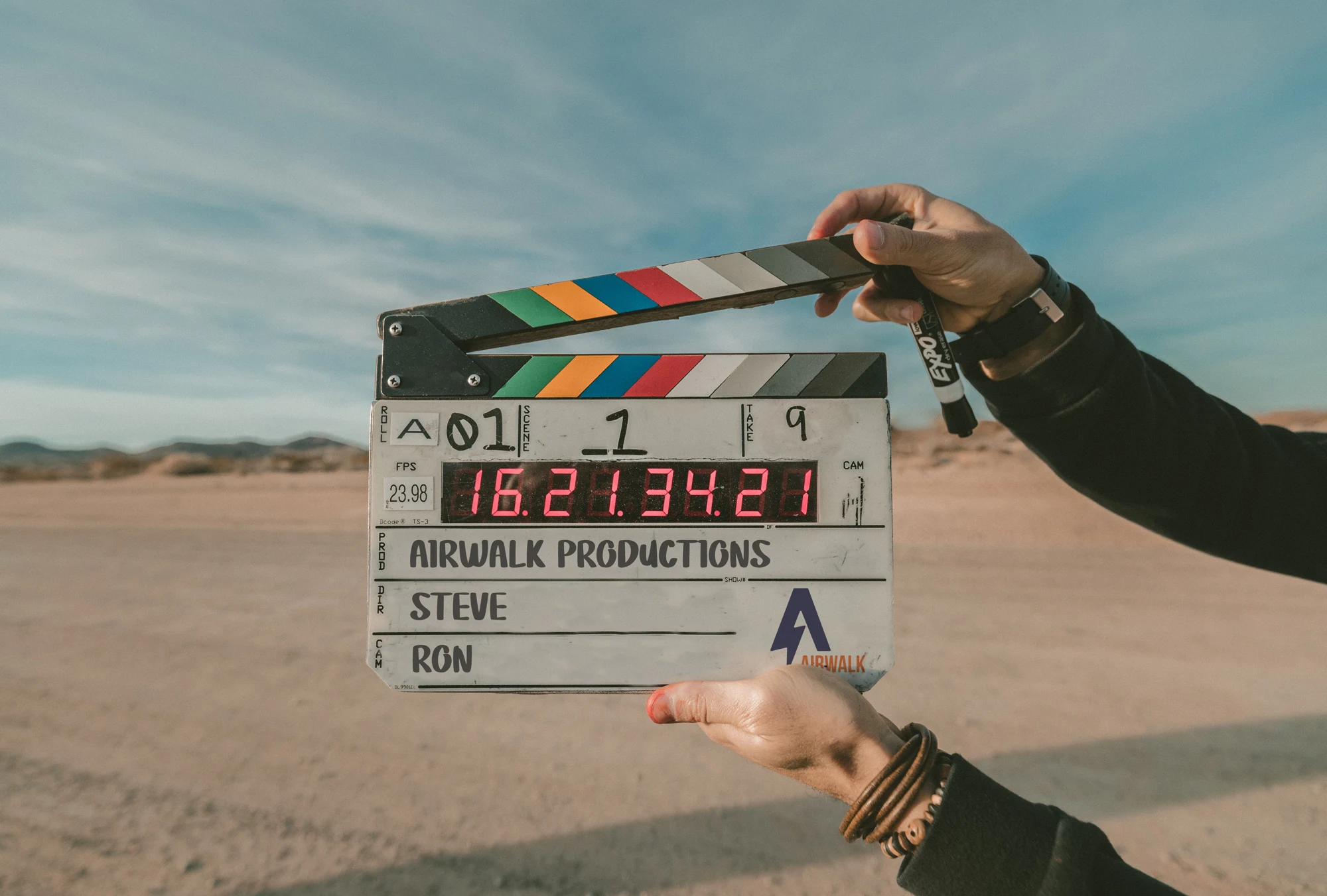Airwalk Productions branded film clapperboard on an outdoor shoot
