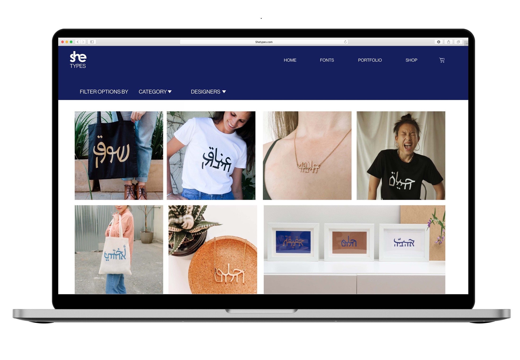 SHE TYPES shop gallery with clothing, jewelry and printed objects