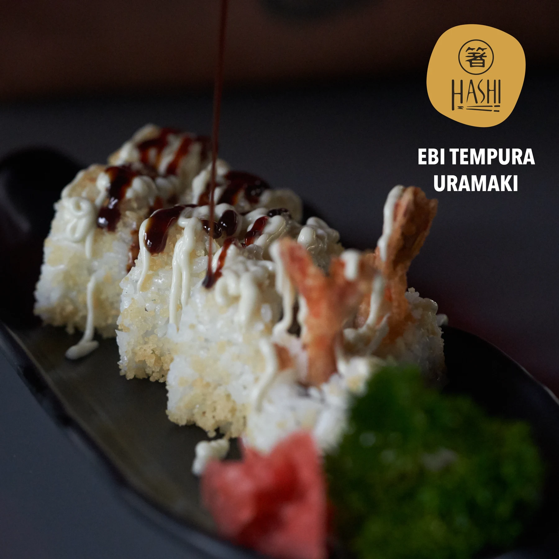Close-up of Ebi tempura uramaki with Hashi branding